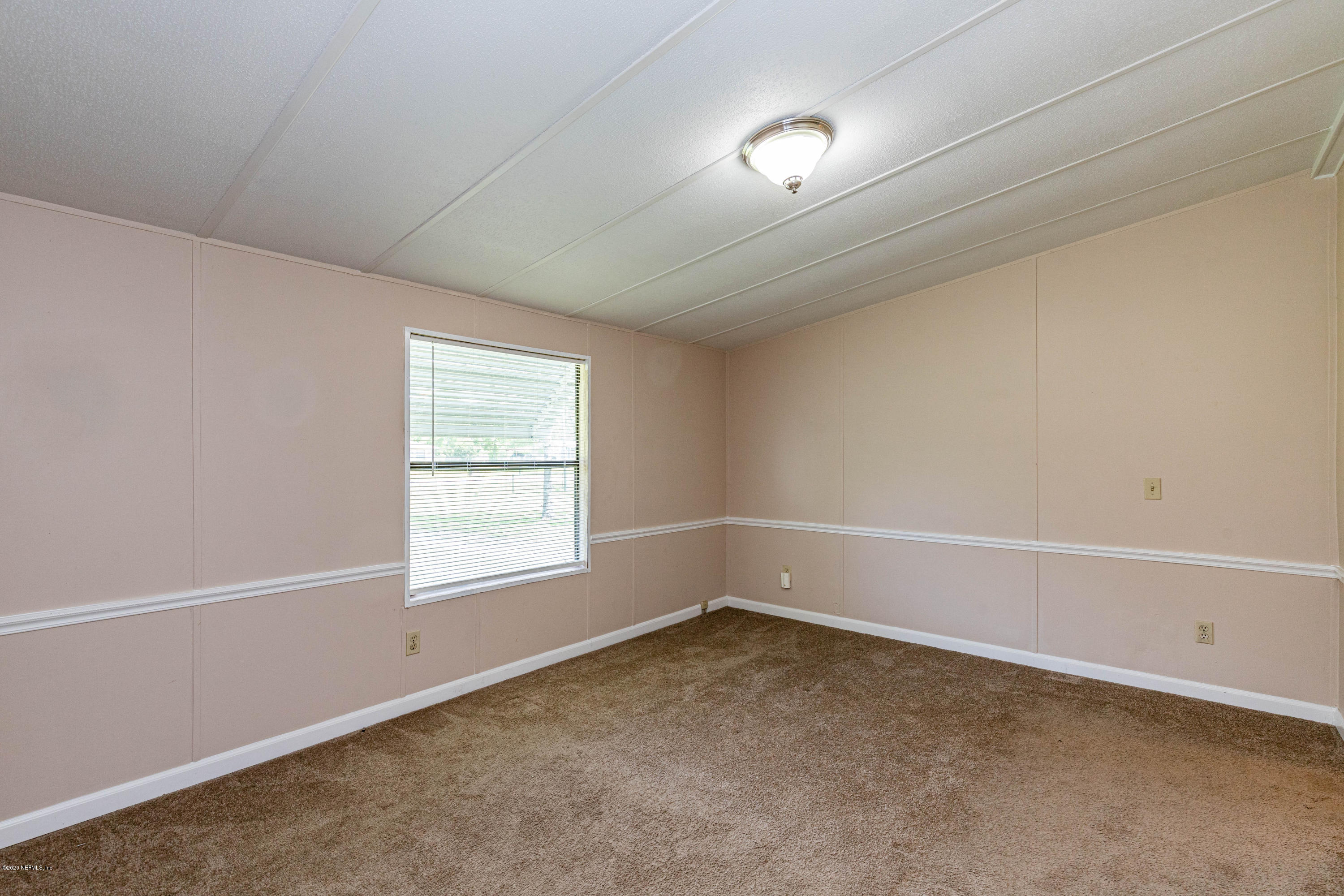 54537 Armstrong Road Callahan, FL 32011 - Photo 17 of 49 an empty room with a window