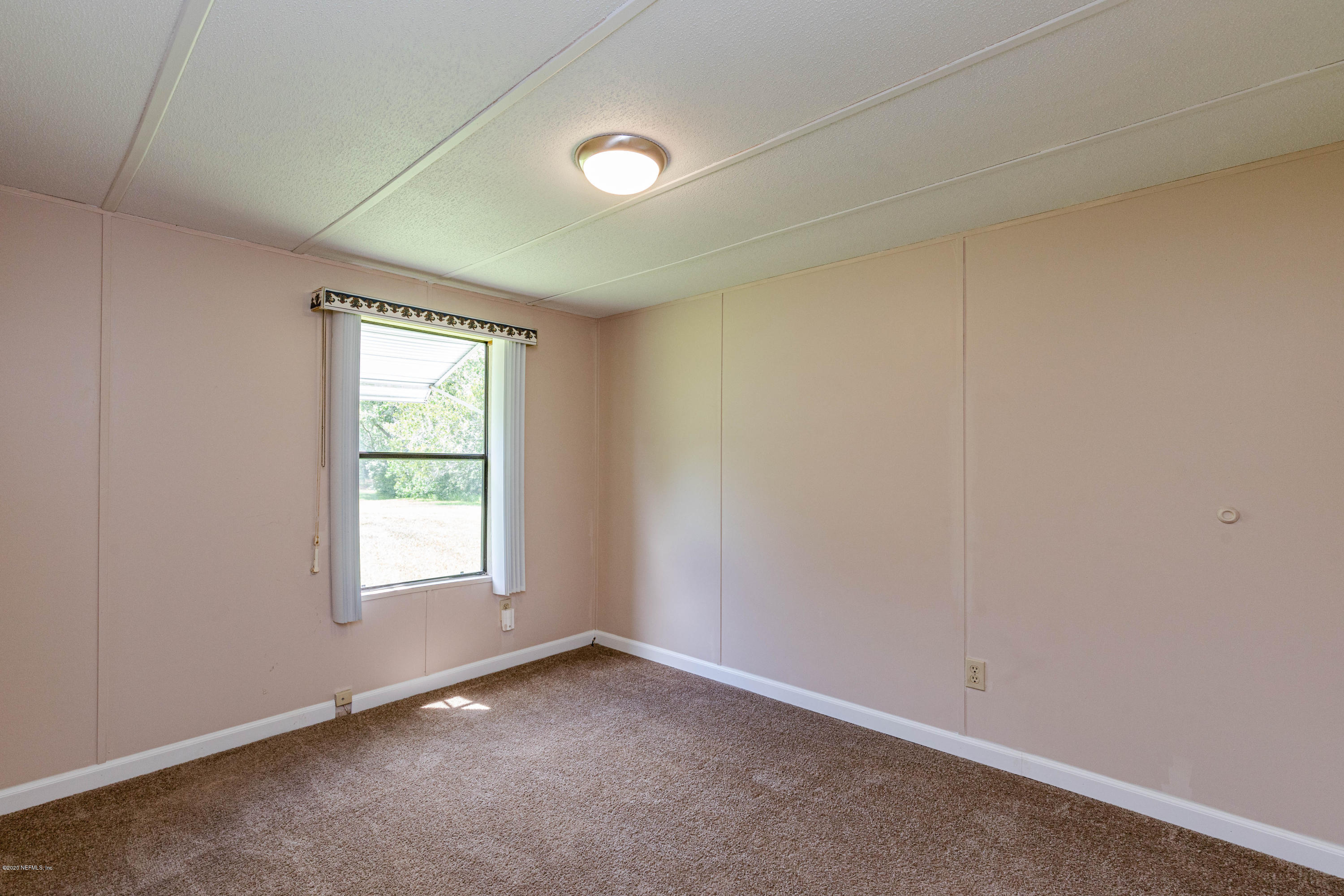 54537 Armstrong Road Callahan, FL 32011 - Photo 25 of 49 an empty room with windows