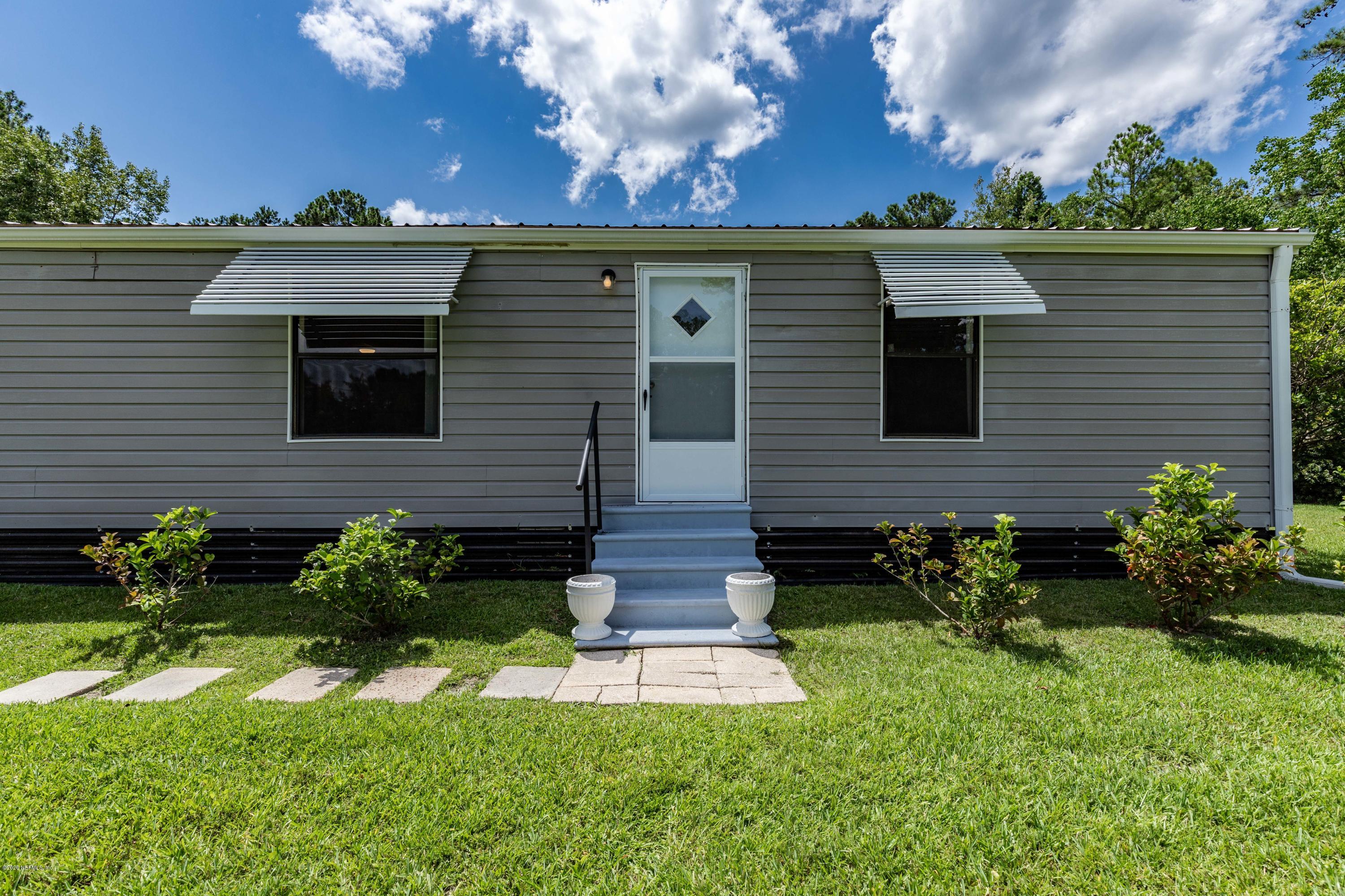 54537 Armstrong Road Callahan, FL 32011 - Photo 27 of 49 a front view of a house with a yard