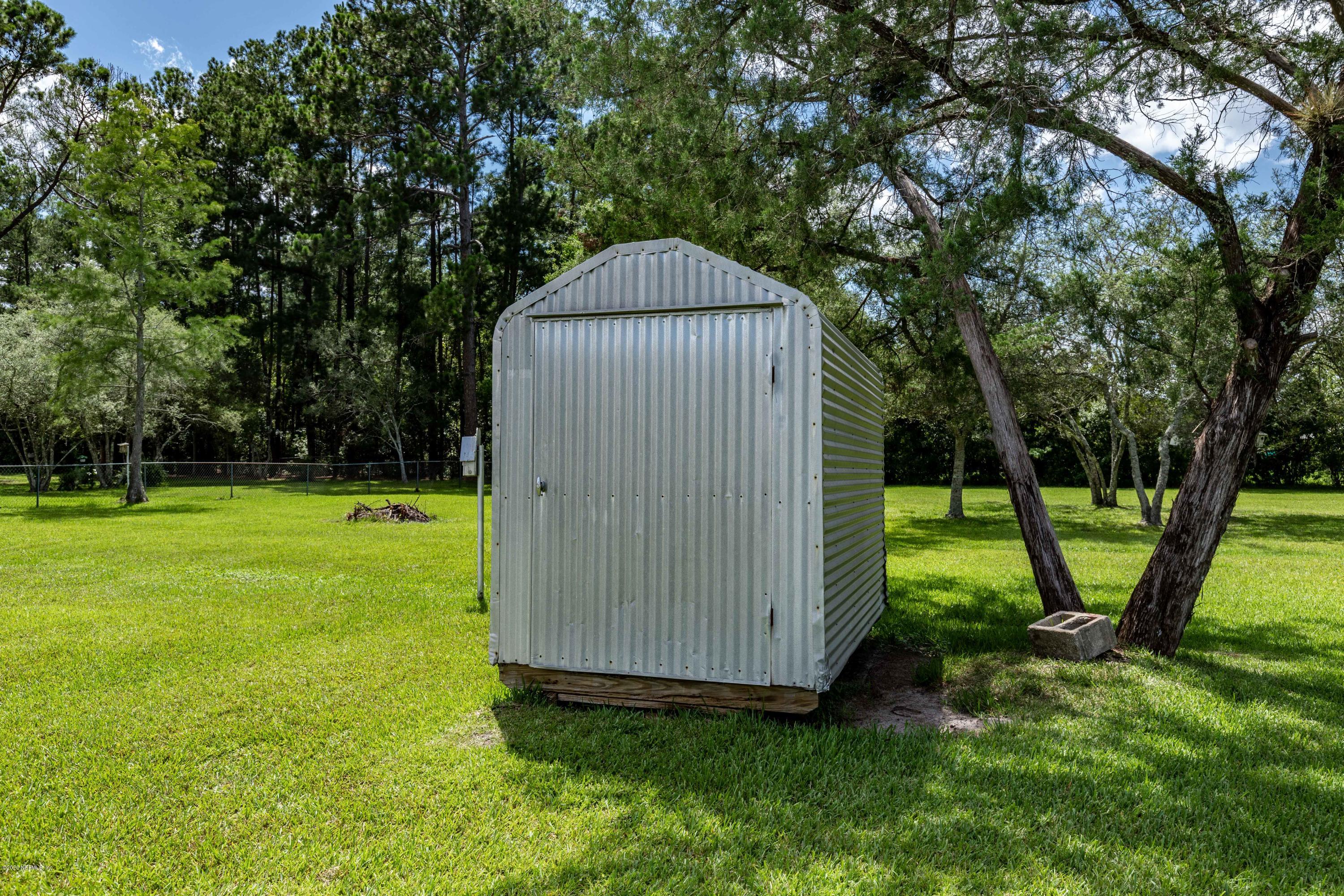 54537 Armstrong Road Callahan, FL 32011 - Photo 36 of 49 a view of a tiny house with a park