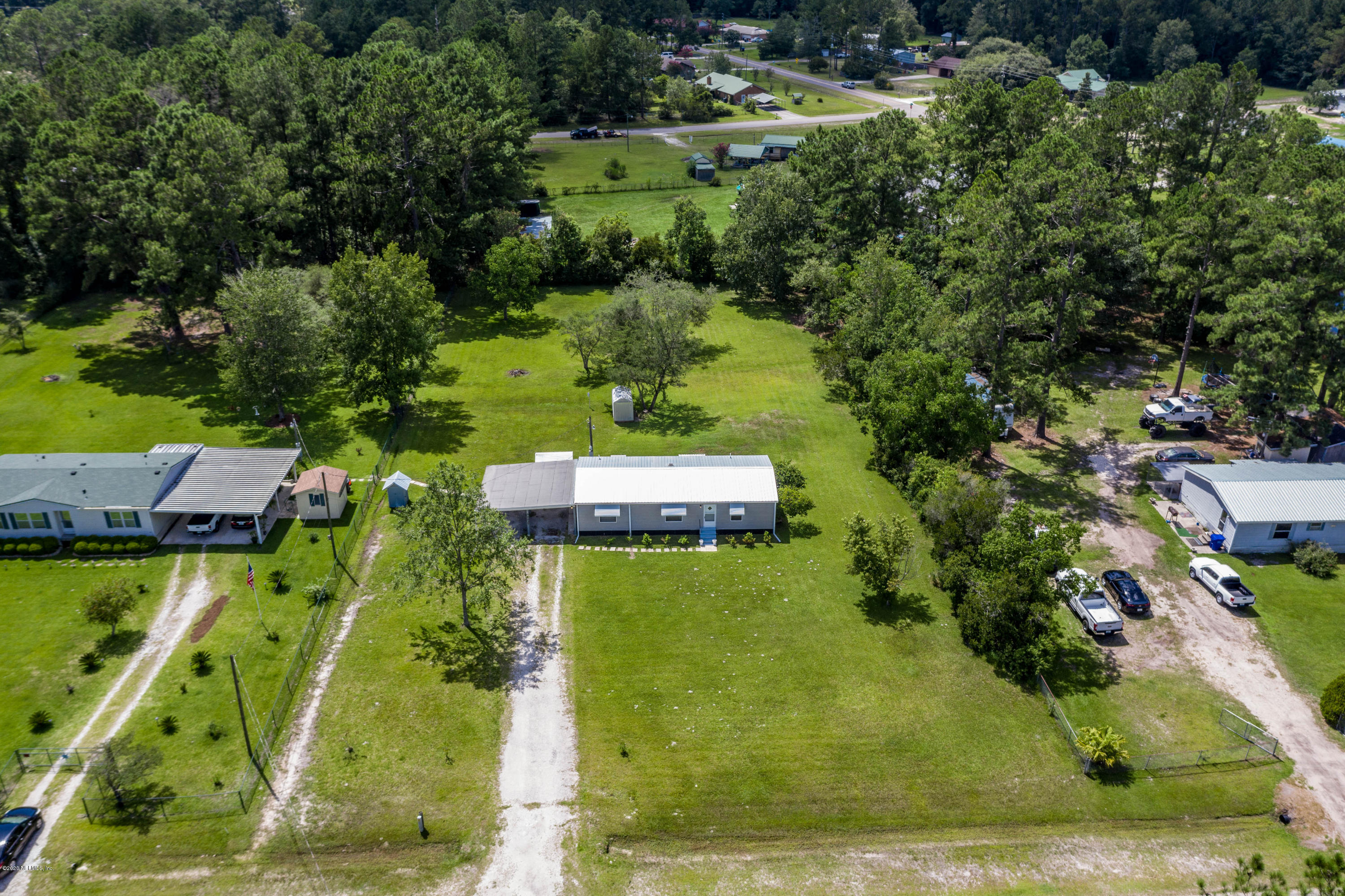 54537 Armstrong Road Callahan, FL 32011 - Photo 42 of 49 an aerial view of a house with yard swimming pool and outdoor seating
