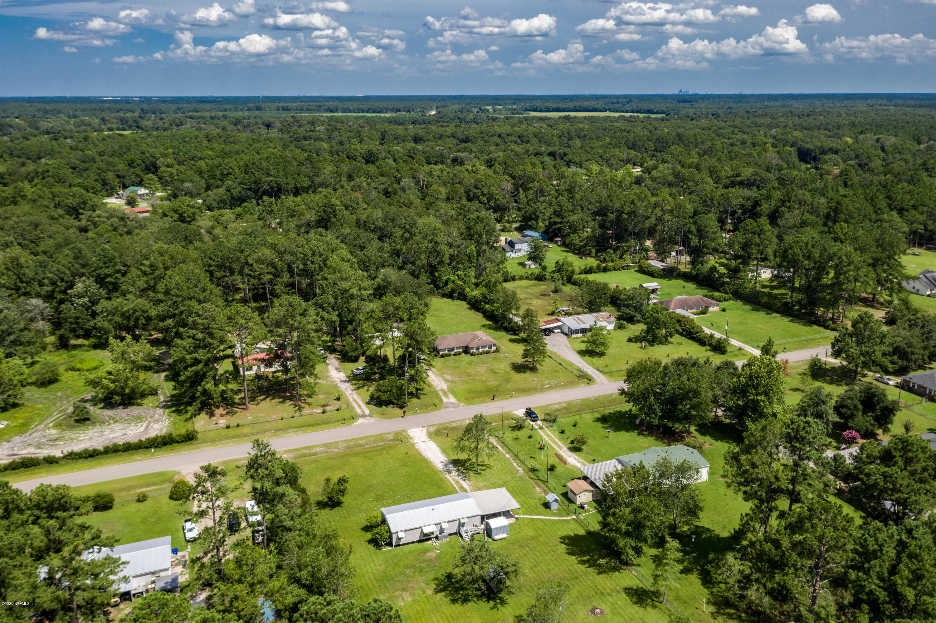 54537 Armstrong Road Callahan, FL 32011 - Photo 48 of 49 an aerial view of residential houses with outdoor space and trees all around