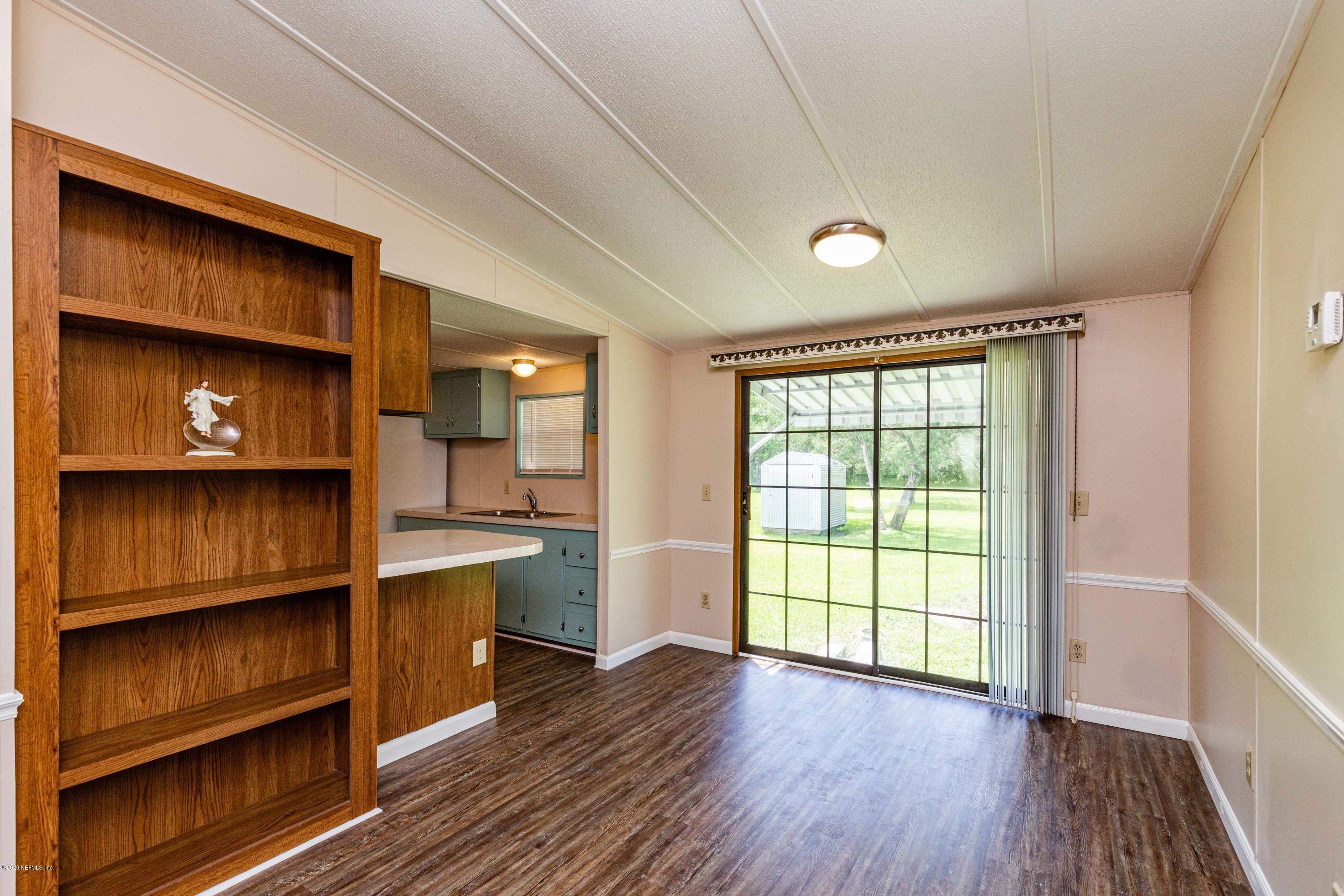 54537 Armstrong Road Callahan, FL 32011 - Photo 8 of 49 a view of room with window and wooden floor