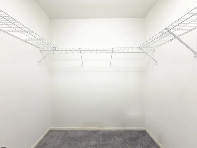 a view of a room with racks on the wall