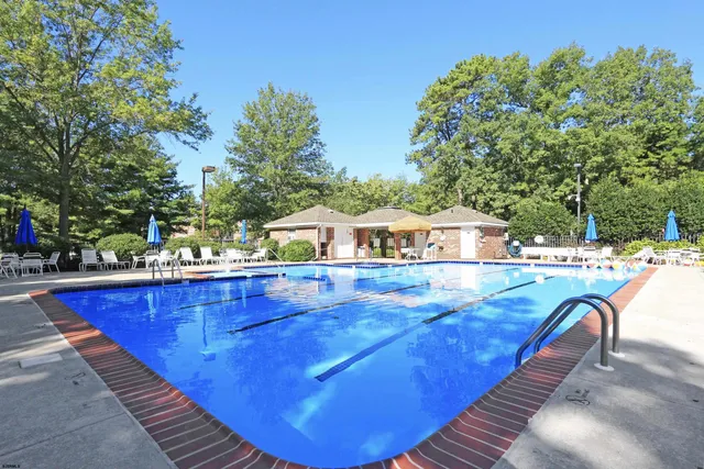 a view of a swimming pool with lounge chair
