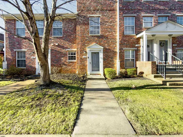 a front view of a house with swimming pool