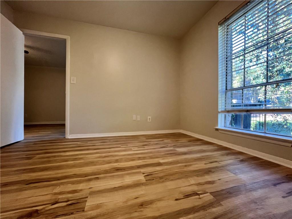 2805 Northeast Expressway Northeast, Unit B13 Atlanta, GA 30345 - Photo 12 of 69 a view of empty room with wooden floor and fan