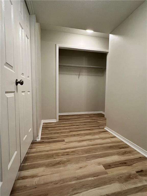 2805 Northeast Expressway Northeast, Unit B13 Atlanta, GA 30345 - Photo 14 of 69 a view of a hallway with wooden floor and closet
