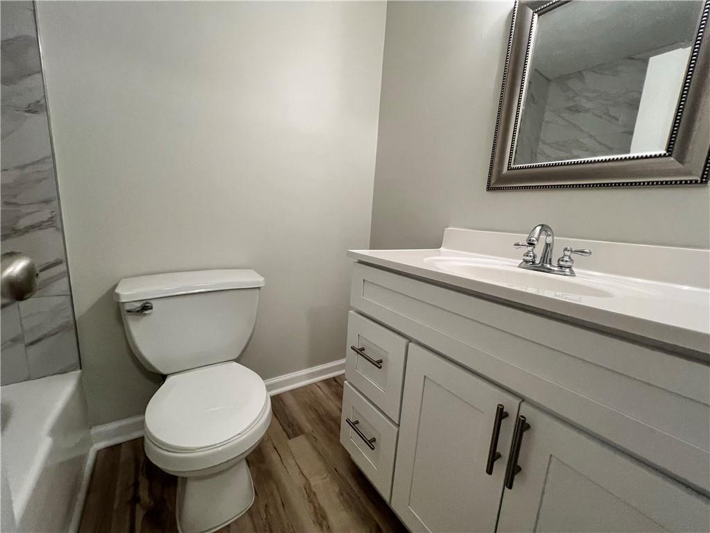 2805 Northeast Expressway Northeast, Unit B13 Atlanta, GA 30345 - Photo 21 of 69 a bathroom with a toilet sink and mirror