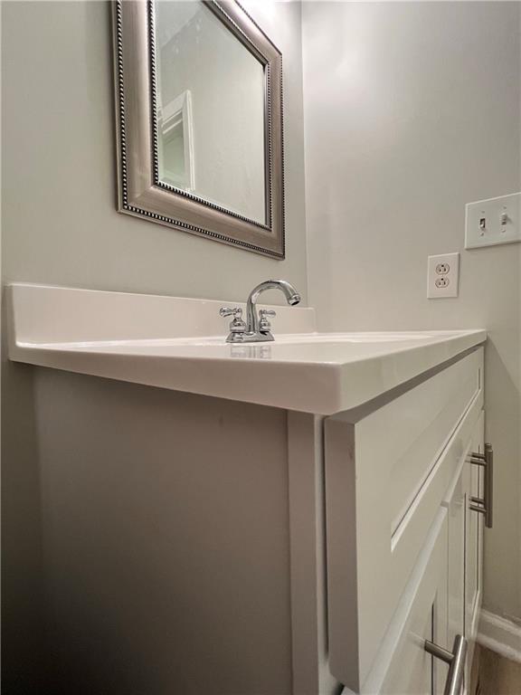 2805 Northeast Expressway Northeast, Unit B13 Atlanta, GA 30345 - Photo 24 of 69 a bathroom with a sink a vanity and a mirror