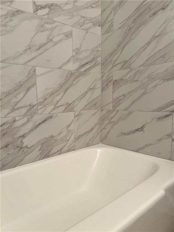 2805 Northeast Expressway Northeast, Unit B13 Atlanta, GA 30345 - Photo 31 of 69 a view of a bathtub in a bathroom