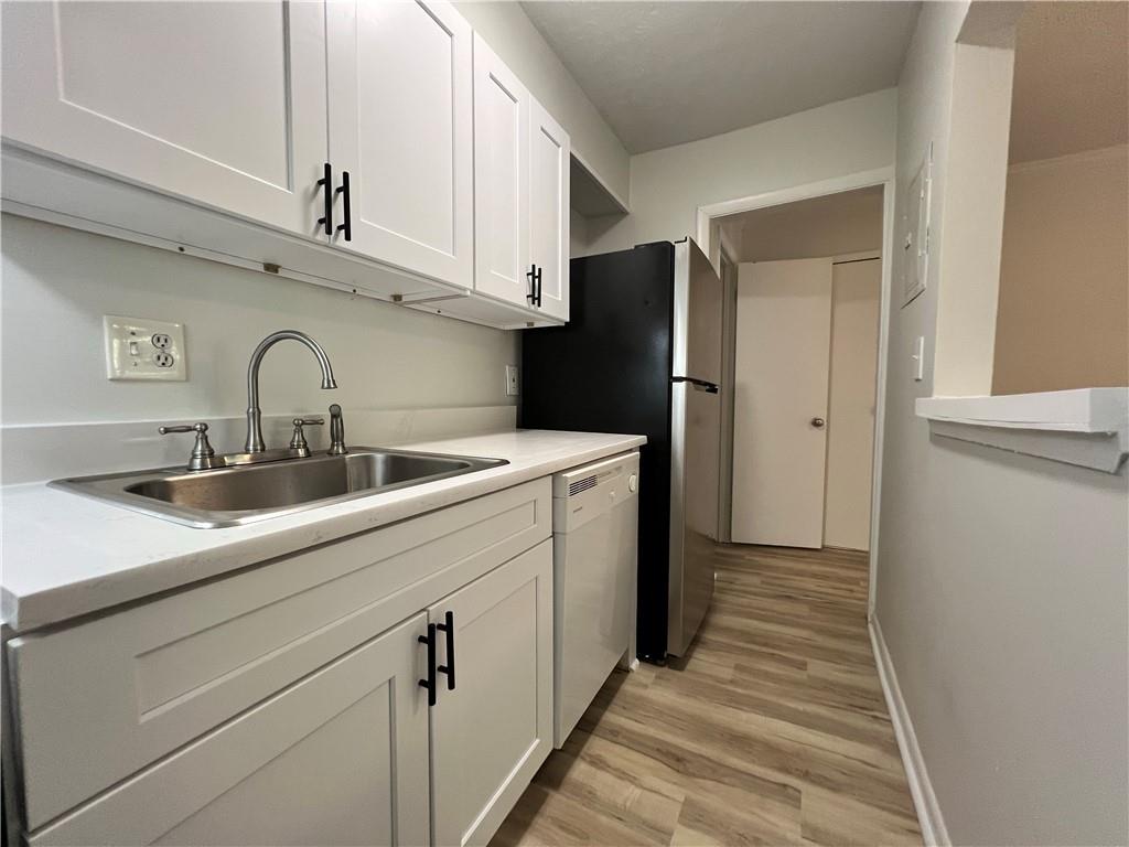 2805 Northeast Expressway Northeast, Unit B13 Atlanta, GA 30345 - Photo 45 of 69 a kitchen with a sink cabinets and stainless steel appliances