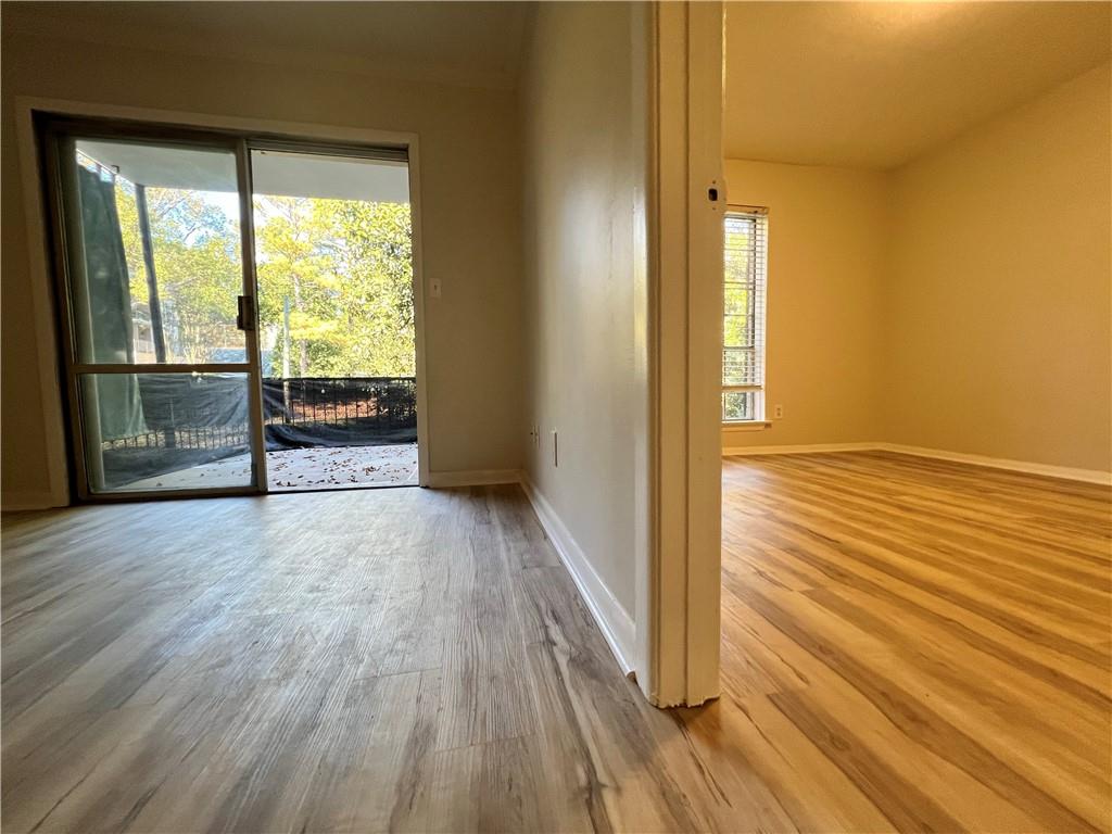 2805 Northeast Expressway Northeast, Unit B13 Atlanta, GA 30345 - Photo 47 of 69 a view of empty room with wooden floor and fan