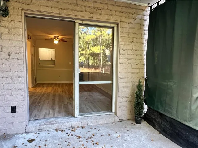 a view of a house with a tree