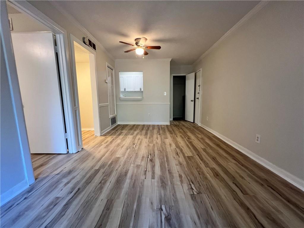 2805 Northeast Expressway Northeast, Unit B13 Atlanta, GA 30345 - Photo 6 of 69 a view of a room with wooden floor fan and windows