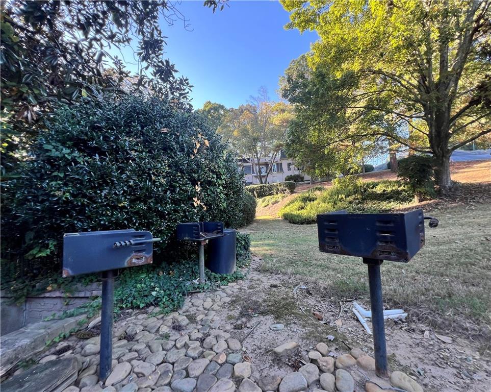 2805 Northeast Expressway Northeast, Unit B13 Atlanta, GA 30345 - Photo 64 of 69 a view of a yard with large trees