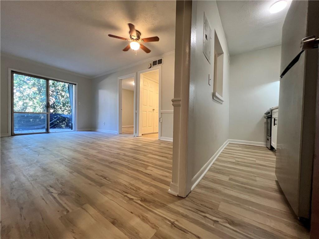 2805 Northeast Expressway Northeast, Unit B13 Atlanta, GA 30345 - Photo 7 of 69 a view of a livingroom with wooden floor and stairs