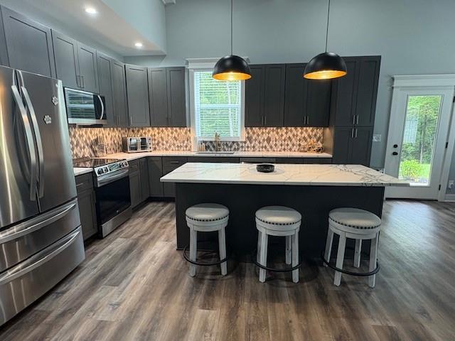 3199 Big Ridge Road Talking Rock, GA 30175 - Photo 17 of 25 a kitchen with stainless steel appliances a dining table chairs and wooden floor