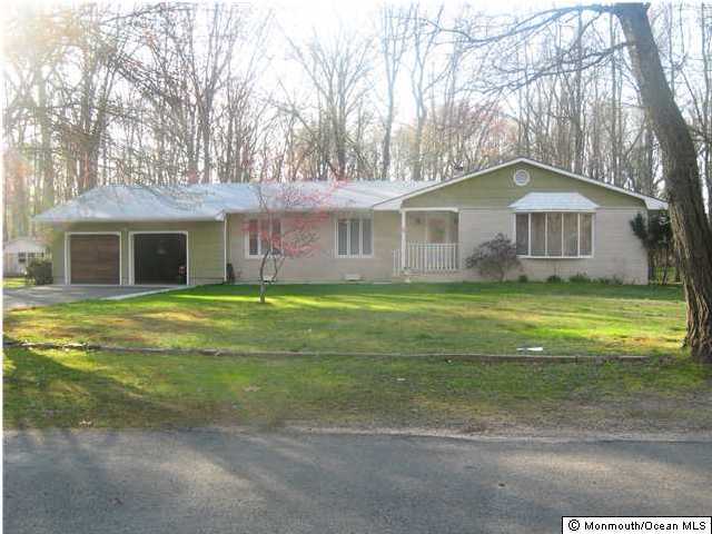 42 Lemon Road Farmingdale, NJ 07727 - Photo 1 of 1 a front view of a house with a yard