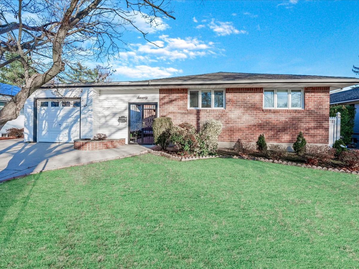 70 Central Park Road Plainview, NY 11803 - Photo 1 of 1 front view of house with a yard