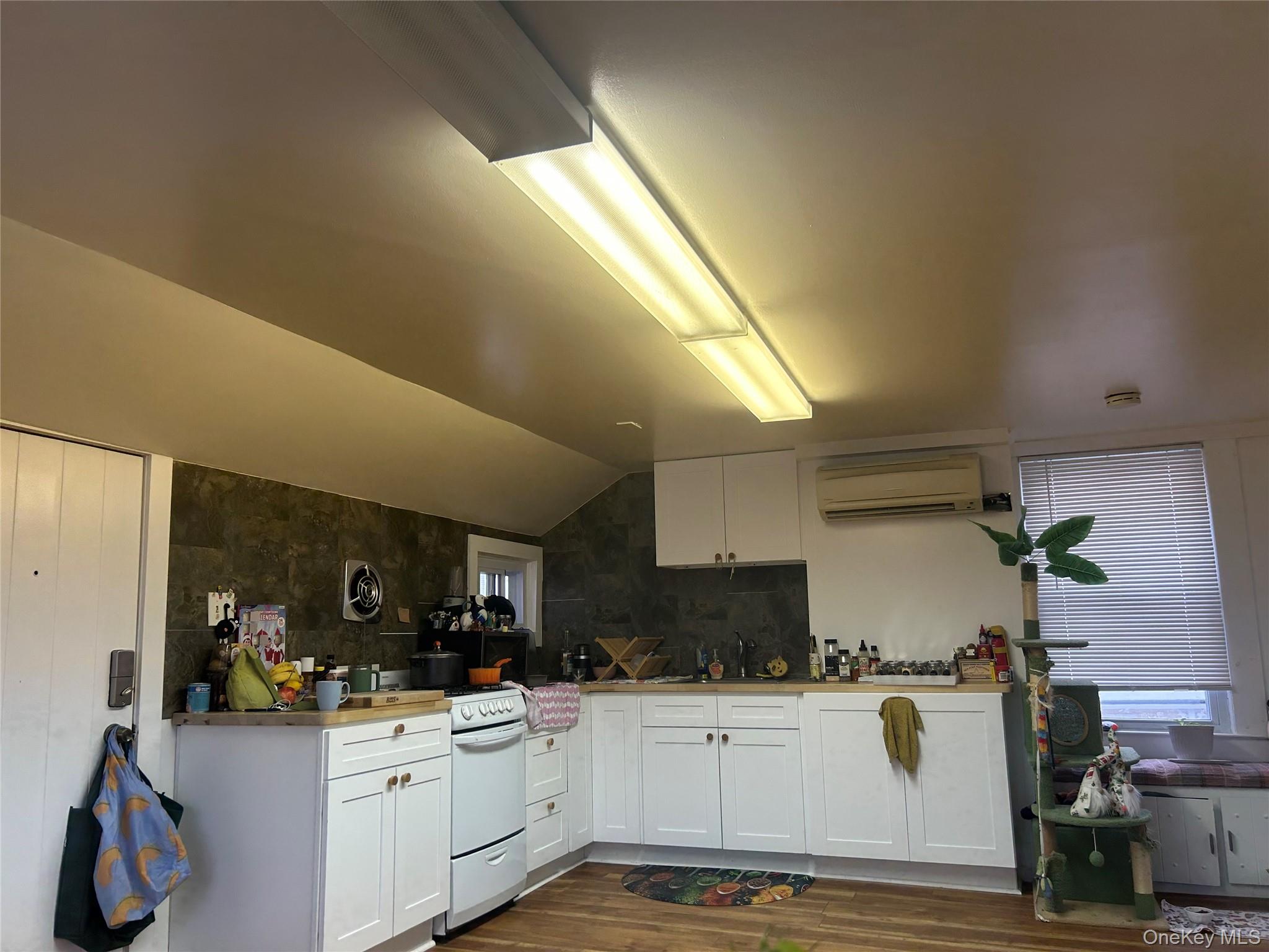 34 Hoffman Street Poughkeepsie, NY 12601 - Photo 4 of 8 a kitchen with a sink stainless steel appliances and cabinets