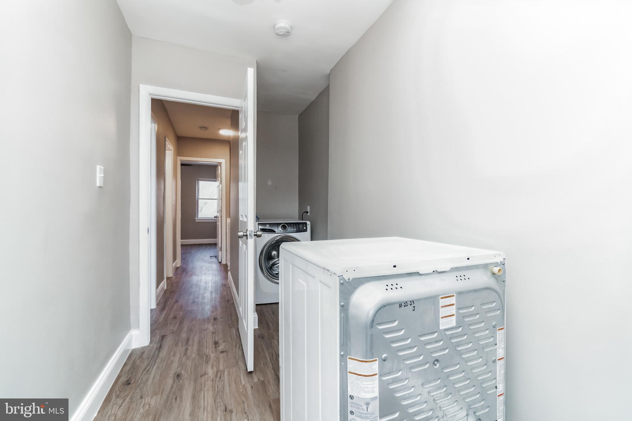 1515 First Street Southwest Washington, DC 20024 - Photo 22 of 37 a view of a hallway with a washer and dryer