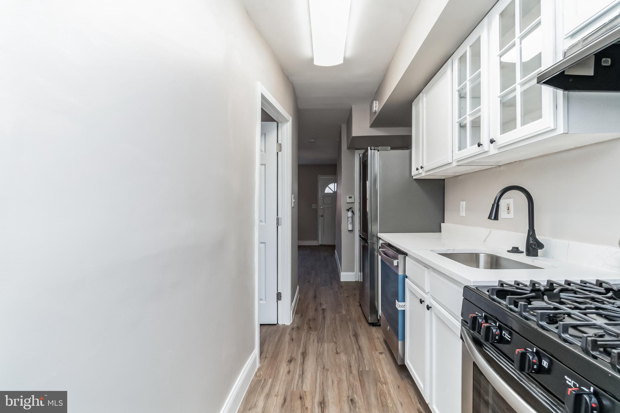 1515 First Street Southwest Washington, DC 20024 - Photo 6 of 37 a kitchen with stainless steel appliances granite countertop a stove and a sink
