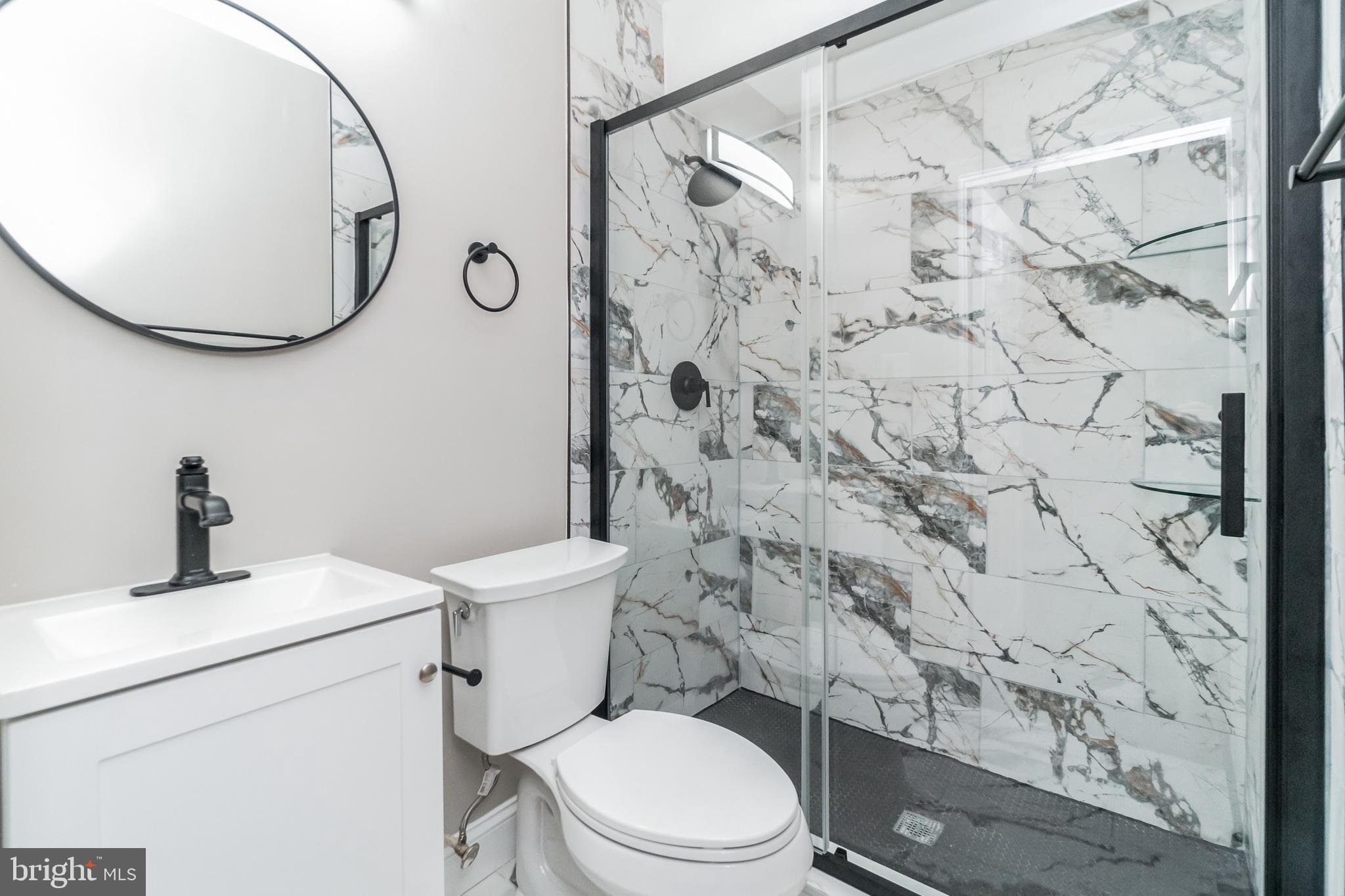 1515 First Street Southwest Washington, DC 20024 - Photo 9 of 37 a bathroom with a toilet sink shower and mirror