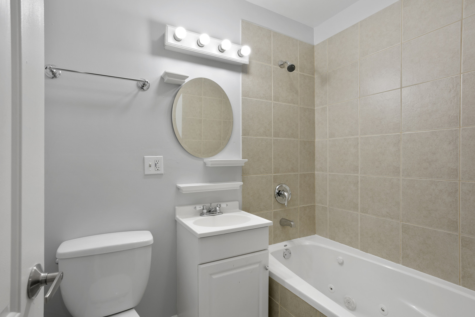 2005 West Jarvis Avenue, Unit 3 Chicago, IL 60645 - Photo 11 of 15 a bathroom with a sink a toilet and bathtub