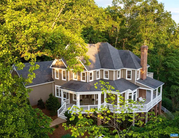 a aerial view of a house with a yard and plants