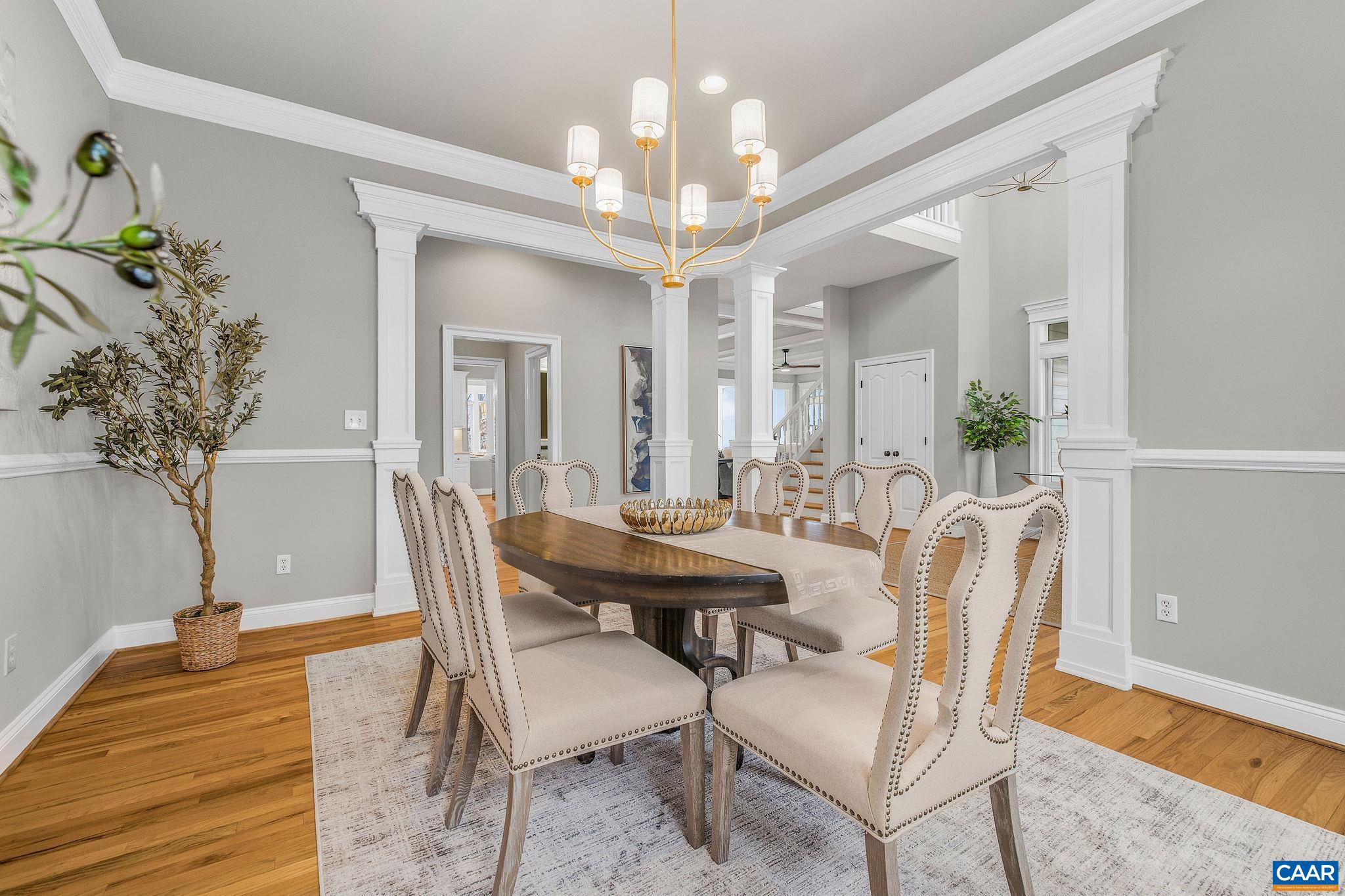 2556 Summit Ridge Trail Charlottesville, VA 22911 - Photo 26 of 75 a view of a dining room with furniture and a chandelier