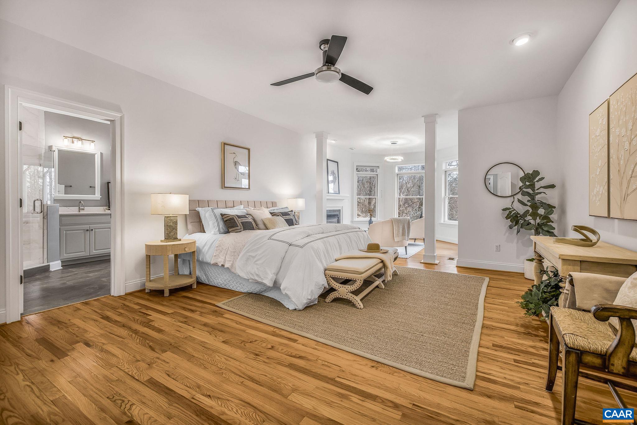 2556 Summit Ridge Trail Charlottesville, VA 22911 - Photo 51 of 75 a bedroom with a bed and wooden floor