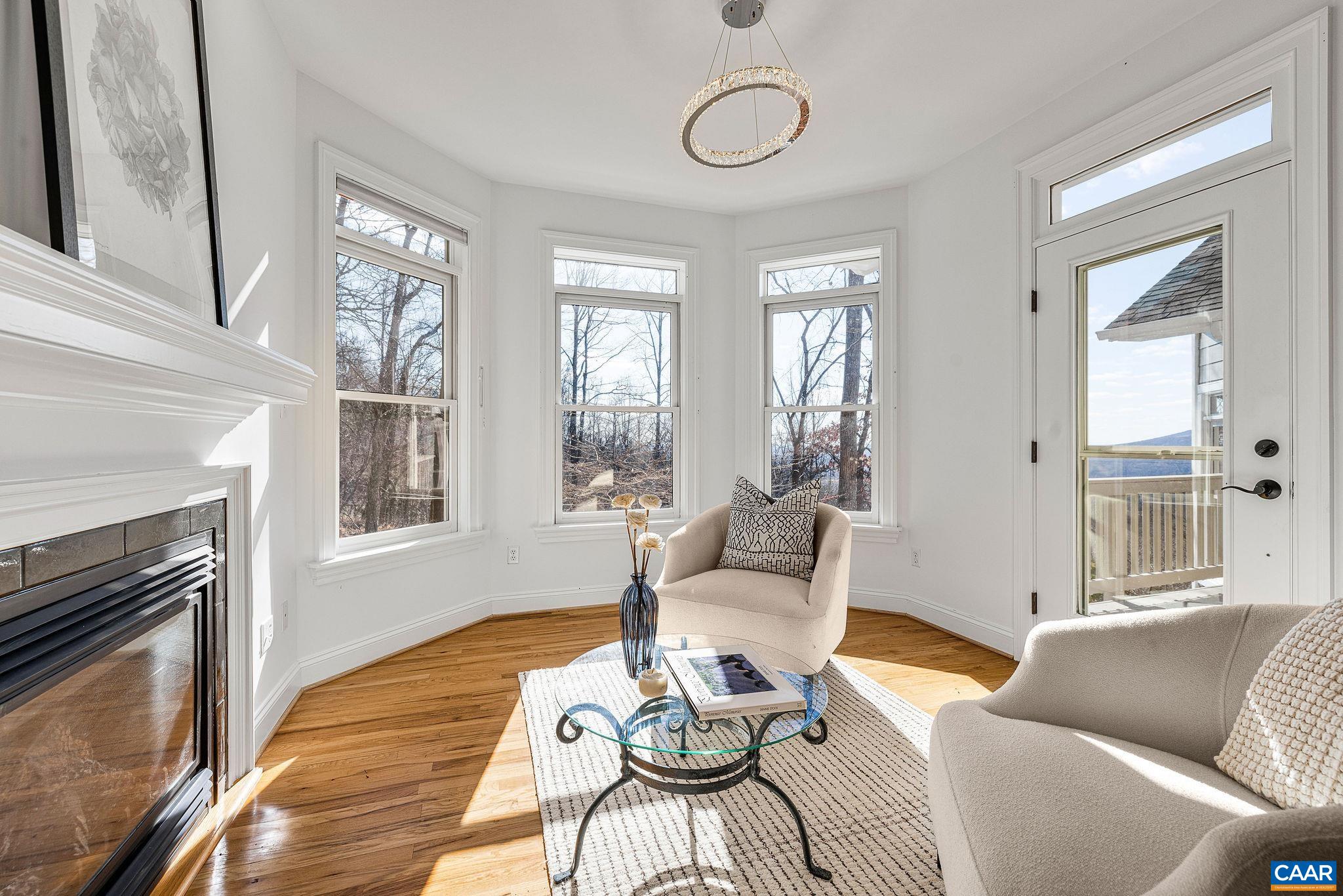 2556 Summit Ridge Trail Charlottesville, VA 22911 - Photo 52 of 75 a living room with furniture a fireplace and wooden floor