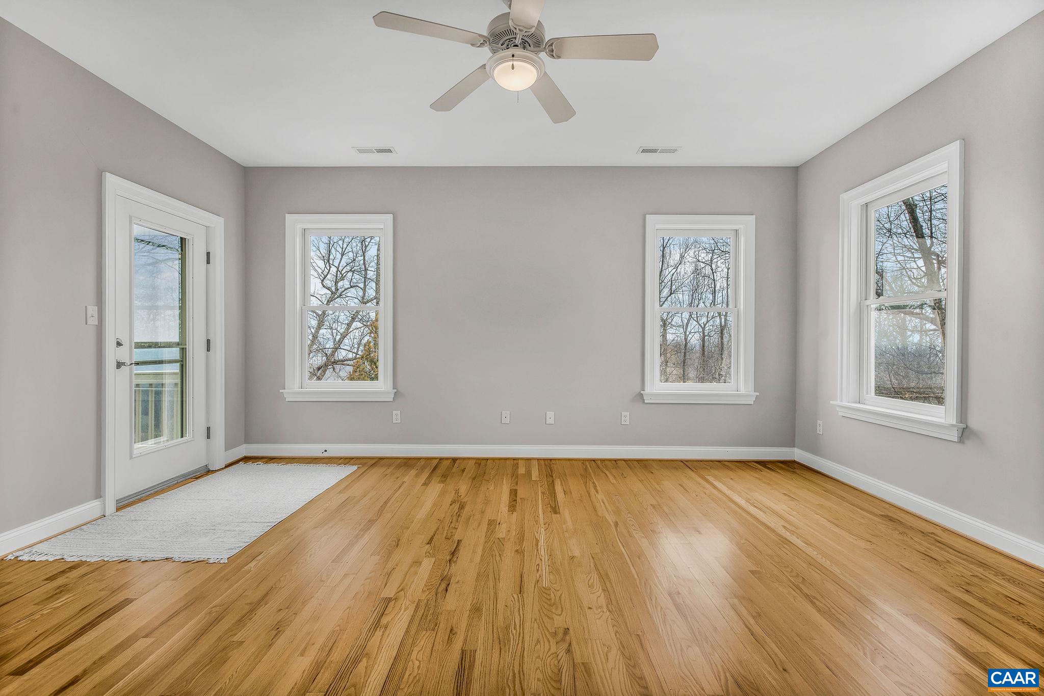 2556 Summit Ridge Trail Charlottesville, VA 22911 - Photo 67 of 75 a view of empty room with wooden floor and fan