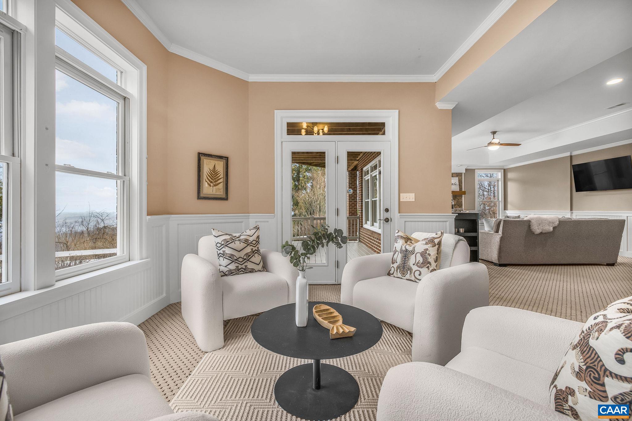2556 Summit Ridge Trail Charlottesville, VA 22911 - Photo 74 of 75 a living room with furniture a large window and a table