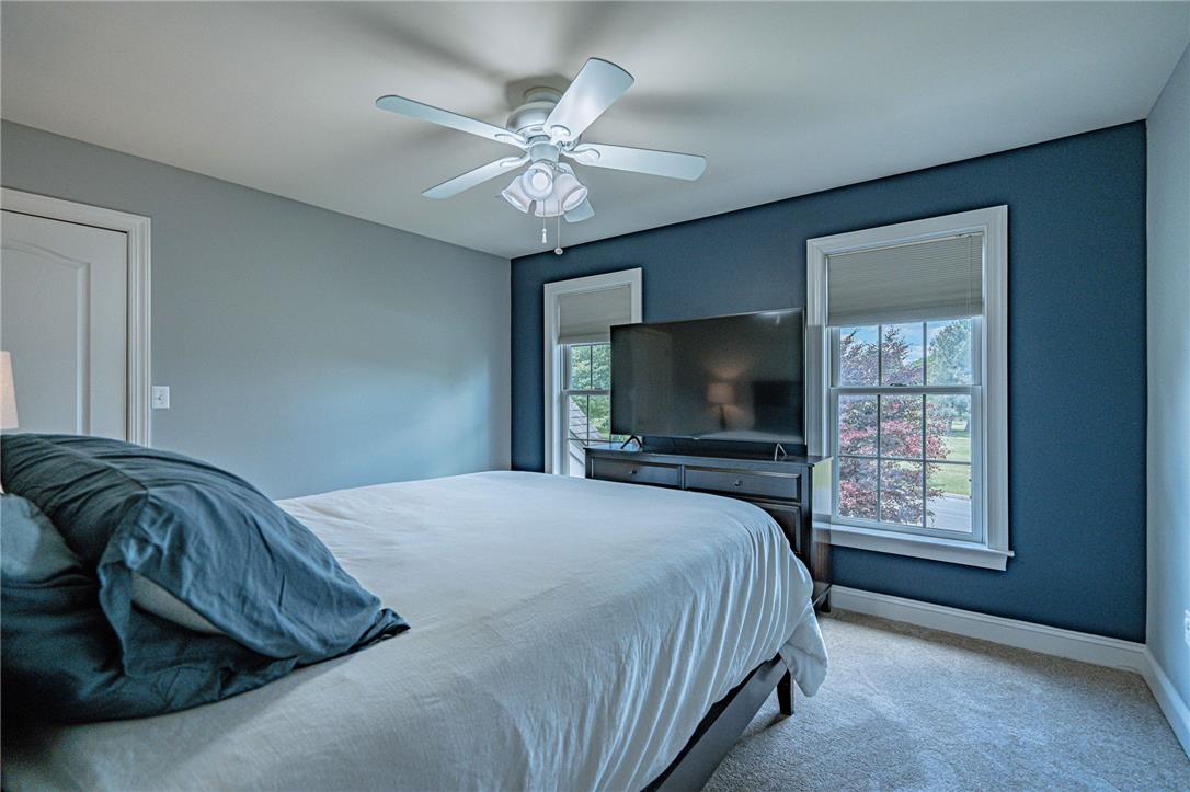 6000 Pond View Terrace Bath, PA 18014 - Photo 47 of 69 A comforting bedroom features a ceiling fan, plush carpet, and dual windows that welcome natural light.