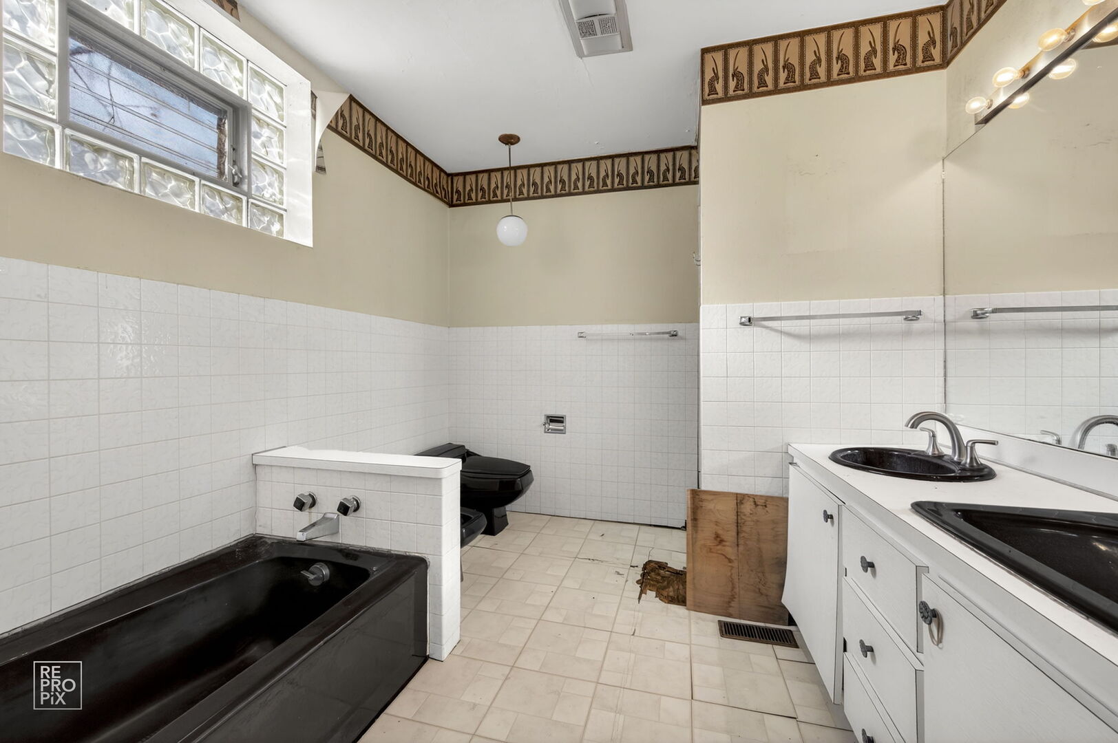 7236 South Michigan Avenue Chicago, IL 60619 - Photo 12 of 15 a kitchen with a sink and cabinets