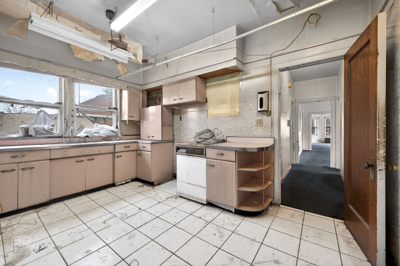 7236 South Michigan Avenue Chicago, IL 60619 - Photo 13 of 15 a kitchen with a sink cabinets and window
