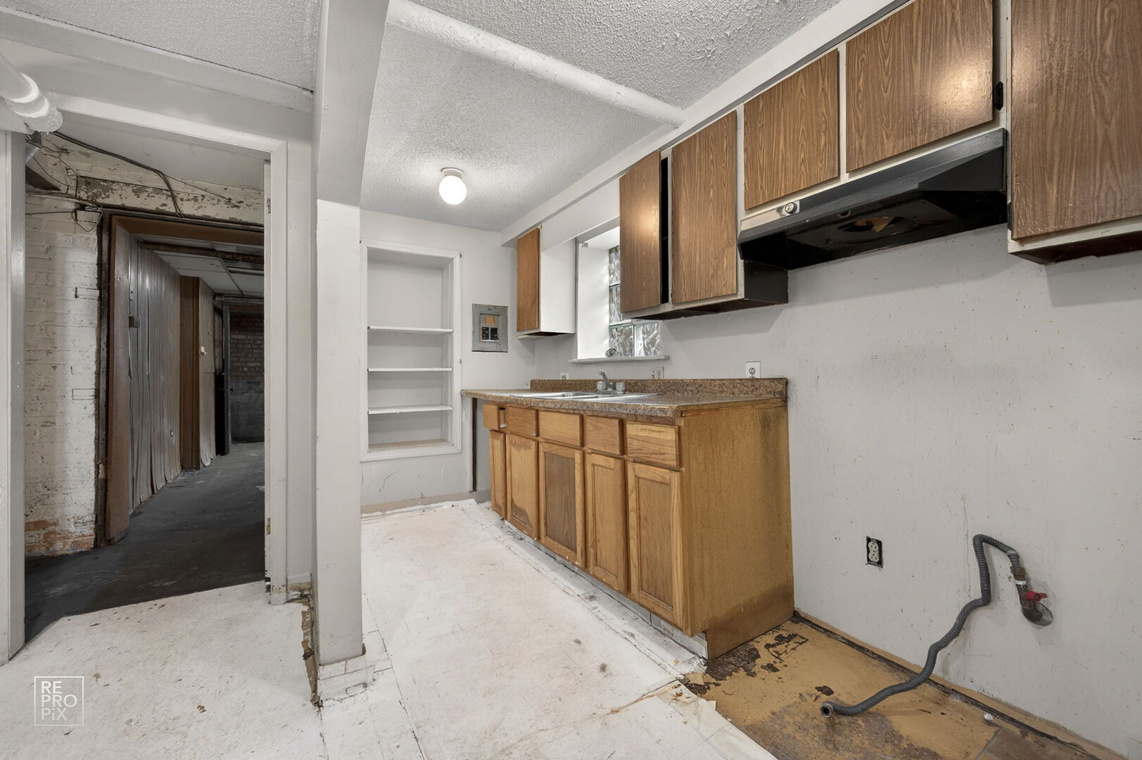 7236 South Michigan Avenue Chicago, IL 60619 - Photo 14 of 15 a kitchen with stainless steel appliances granite countertop a sink stove and cabinets