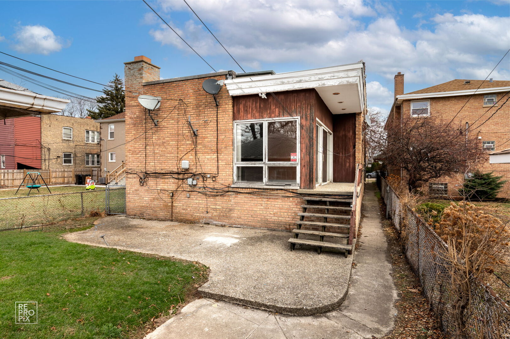 7236 South Michigan Avenue Chicago, IL 60619 - Photo 15 of 15 a view of a house with backyard and porch