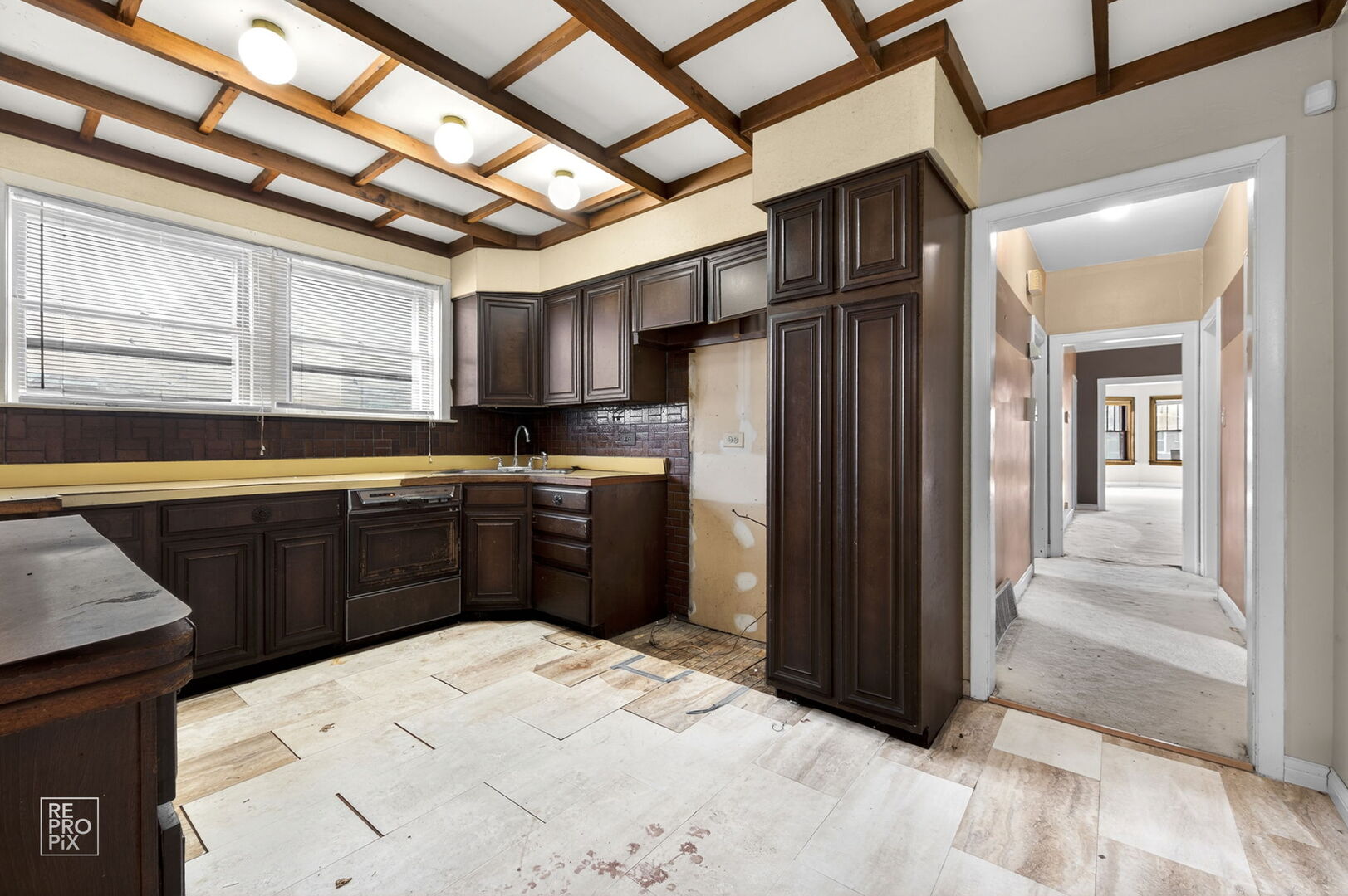 7236 South Michigan Avenue Chicago, IL 60619 - Photo 4 of 15 a kitchen with stainless steel appliances kitchen island granite countertop a refrigerator and a sink