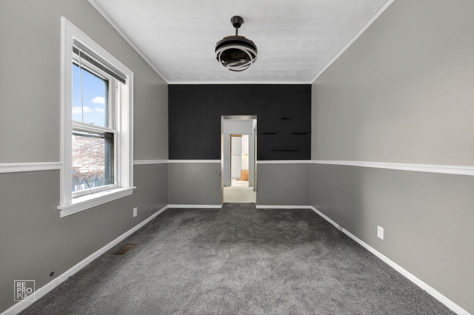 7236 South Michigan Avenue Chicago, IL 60619 - Photo 8 of 15 an empty room with windows