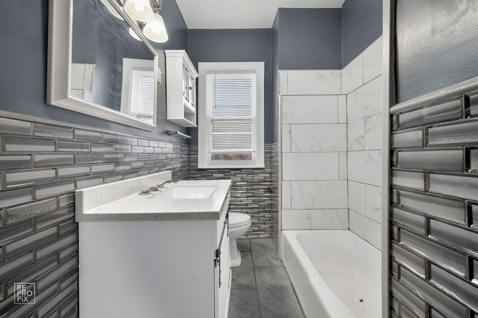 7236 South Michigan Avenue Chicago, IL 60619 - Photo 10 of 15 a bathroom with a sink and a bathtub