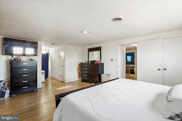 a bed room with a bed and a television