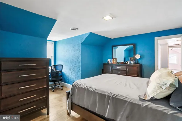 a bedroom with a bed and a closet