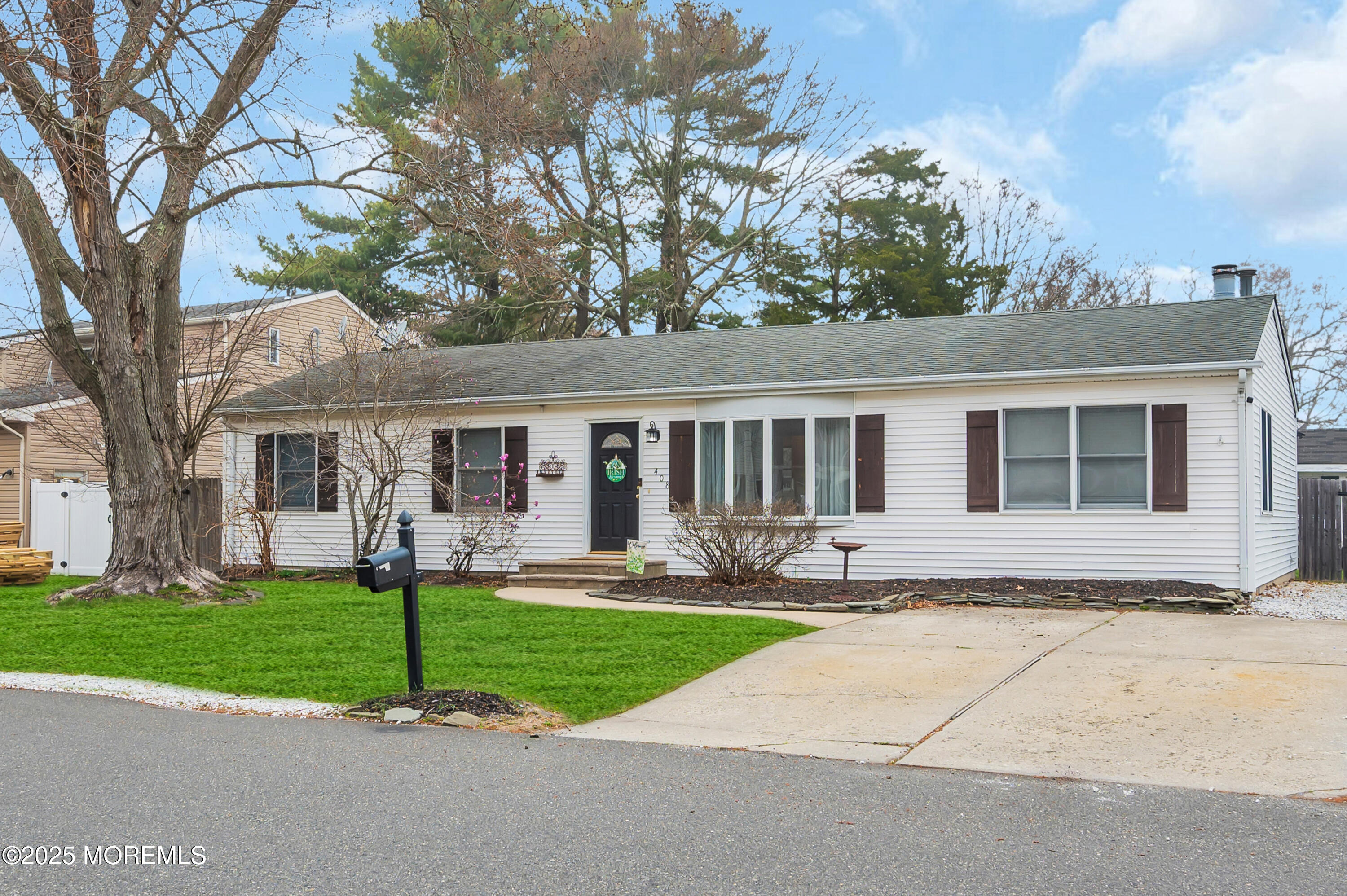 408 Cedar Drive Lanoka Harbor, NJ 08734 - Photo 1 of 39 a front view of house with yard and green space