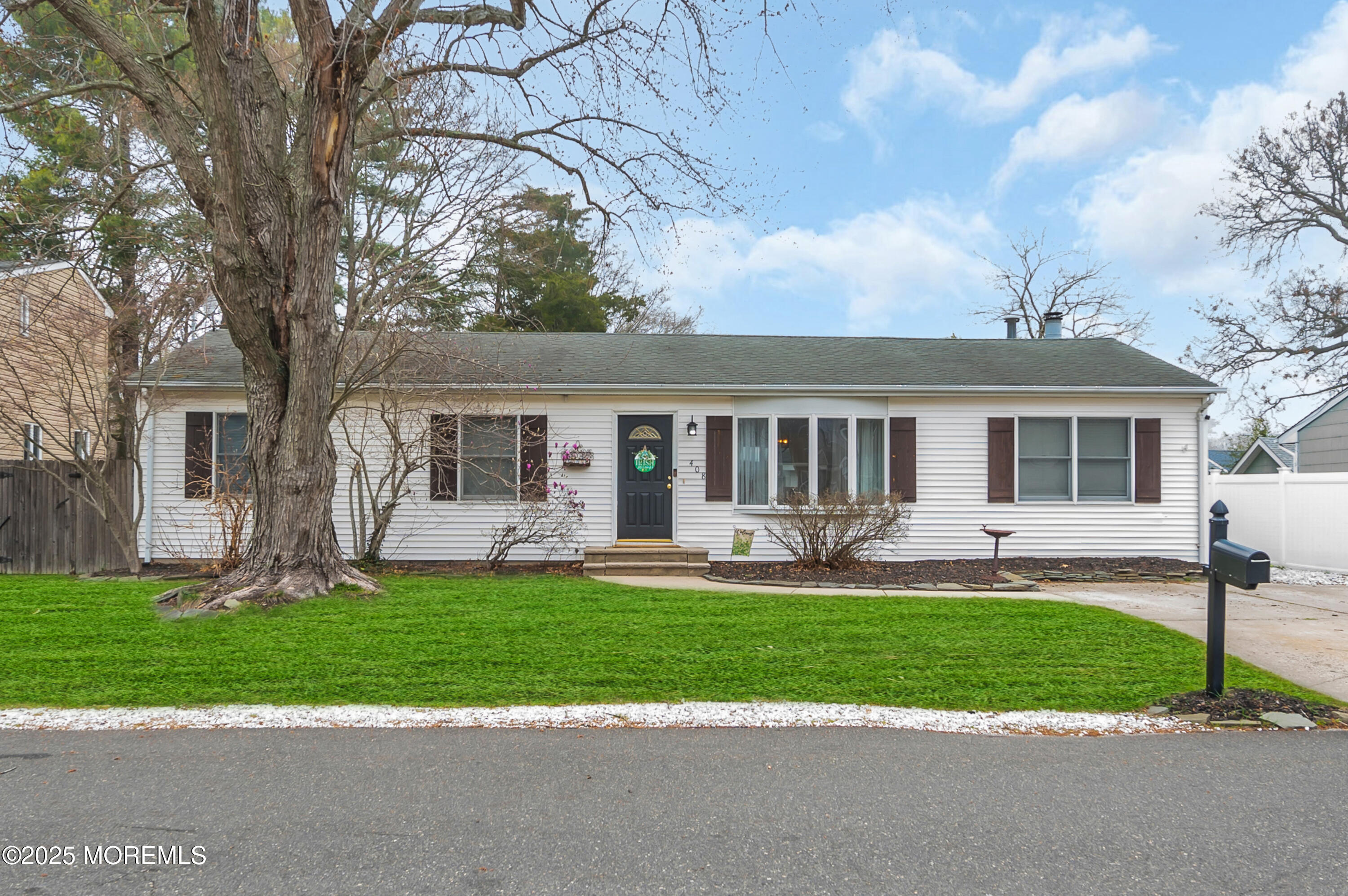 408 Cedar Drive Lanoka Harbor, NJ 08734 - Photo 2 of 39 a front view of a house with a yard and porch