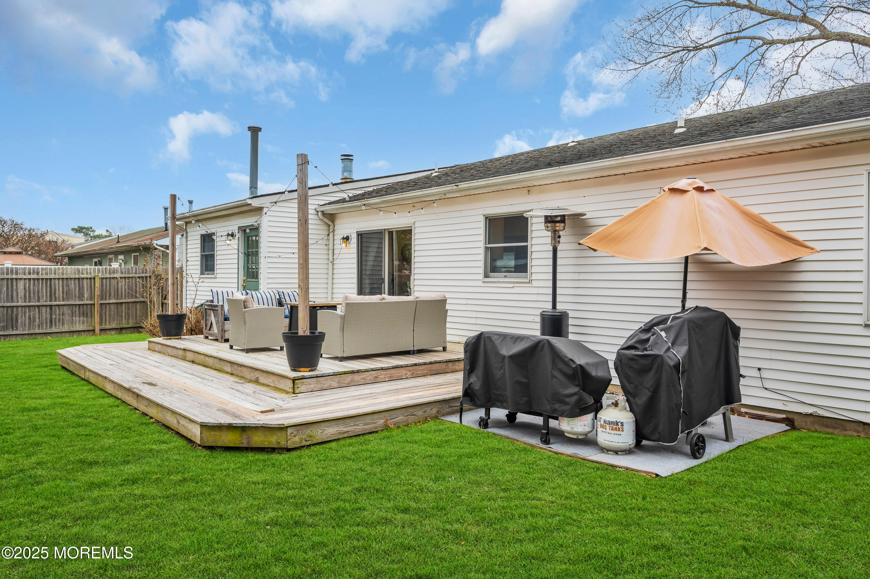 408 Cedar Drive Lanoka Harbor, NJ 08734 - Photo 28 of 39 a view of a house with a yard and chairs