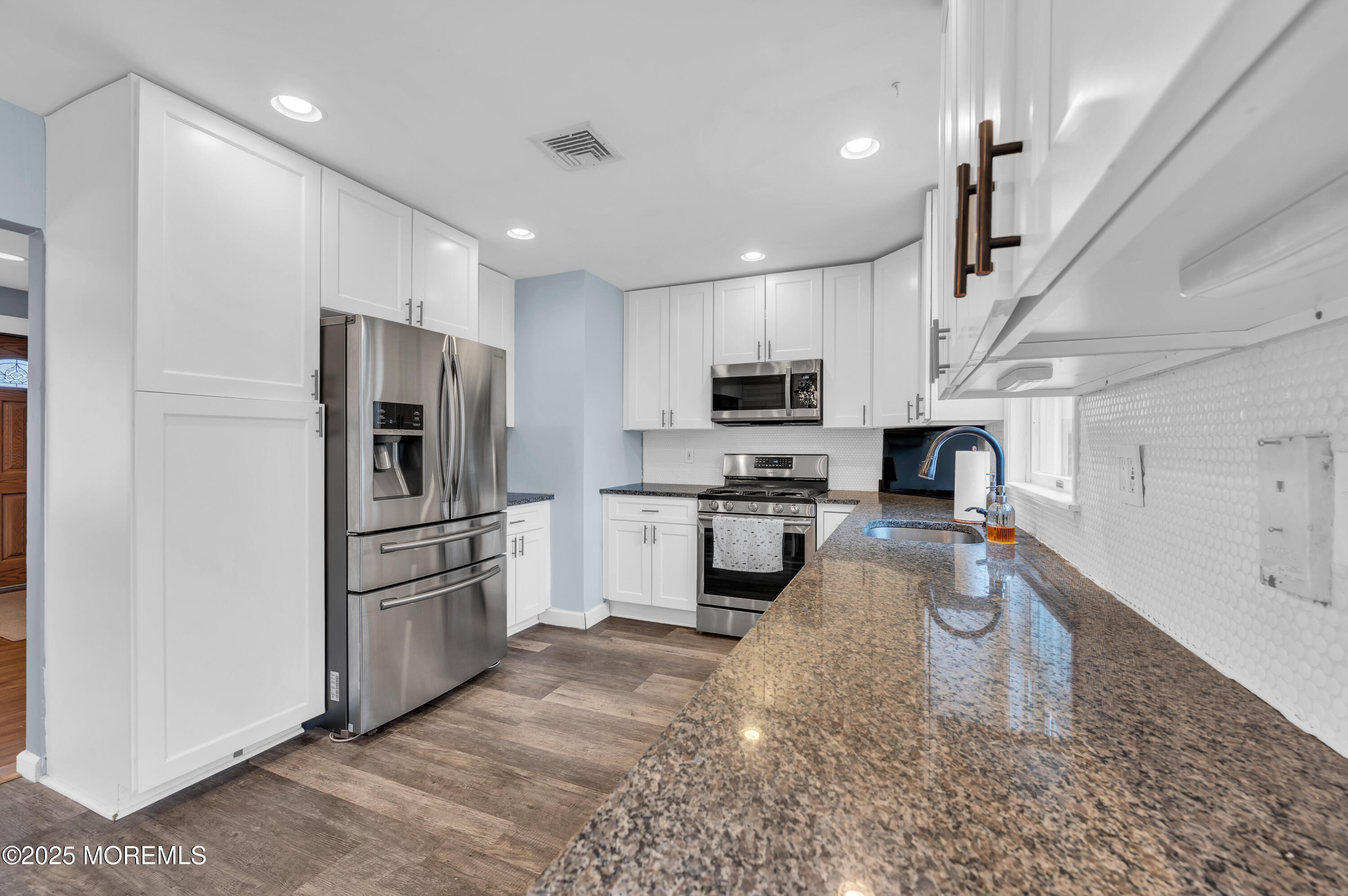408 Cedar Drive Lanoka Harbor, NJ 08734 - Photo 3 of 39 a kitchen with white cabinets and stainless steel appliances