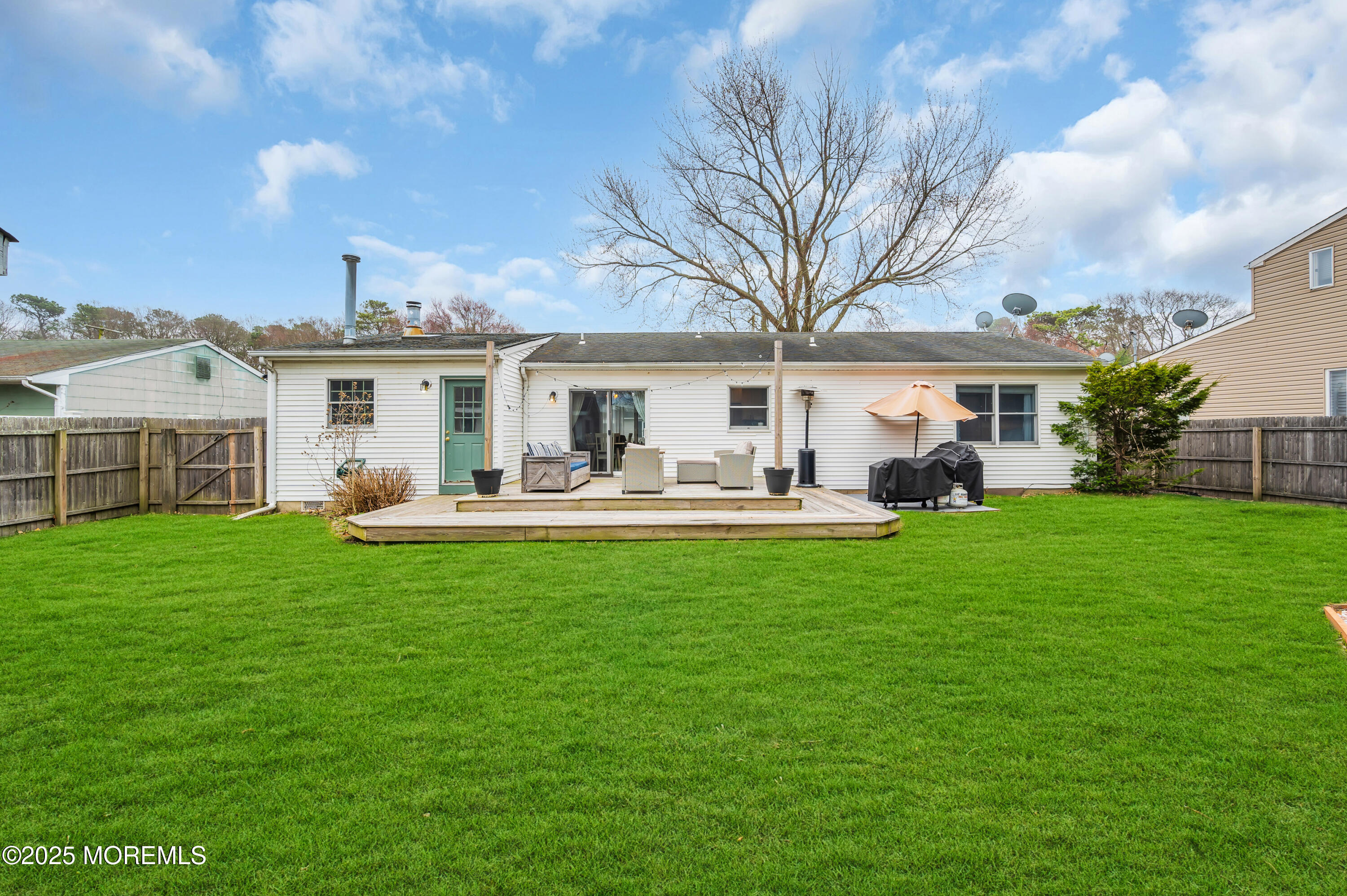 408 Cedar Drive Lanoka Harbor, NJ 08734 - Photo 31 of 39 a front view of a house with garden